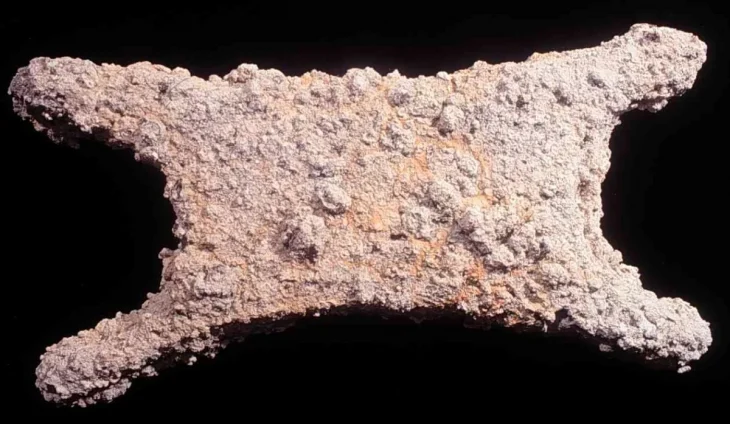 Tin ingot in the shape of an ox-hide prior to cleaning